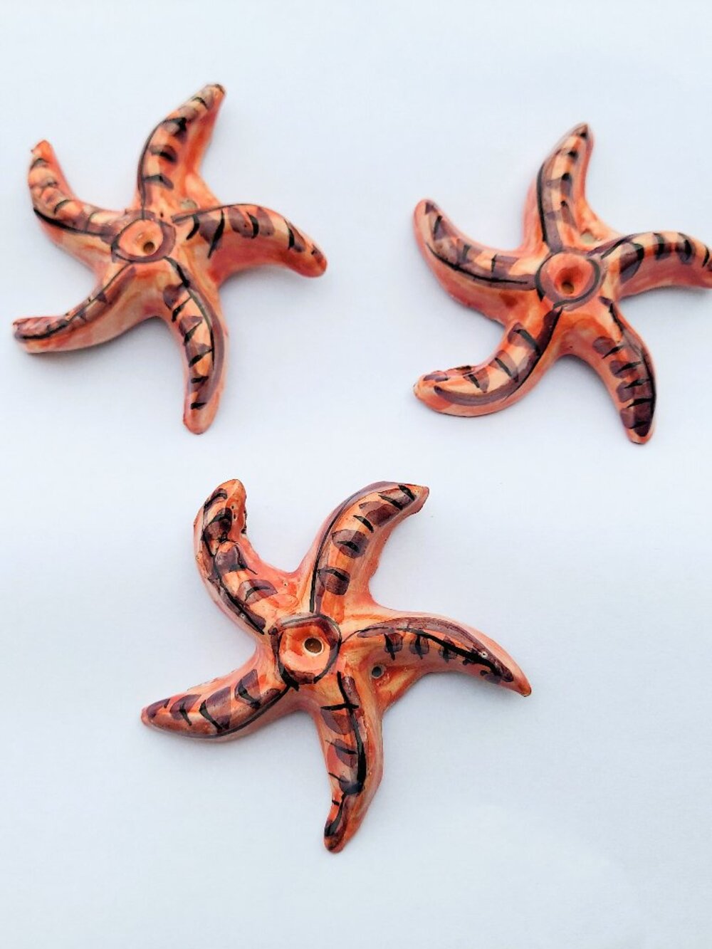 Coral Colored Pottery Starfish - set of 3